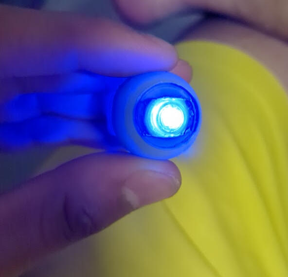 I used two blue kid's finger lights to make my eyes light up, worked surprisingly well!